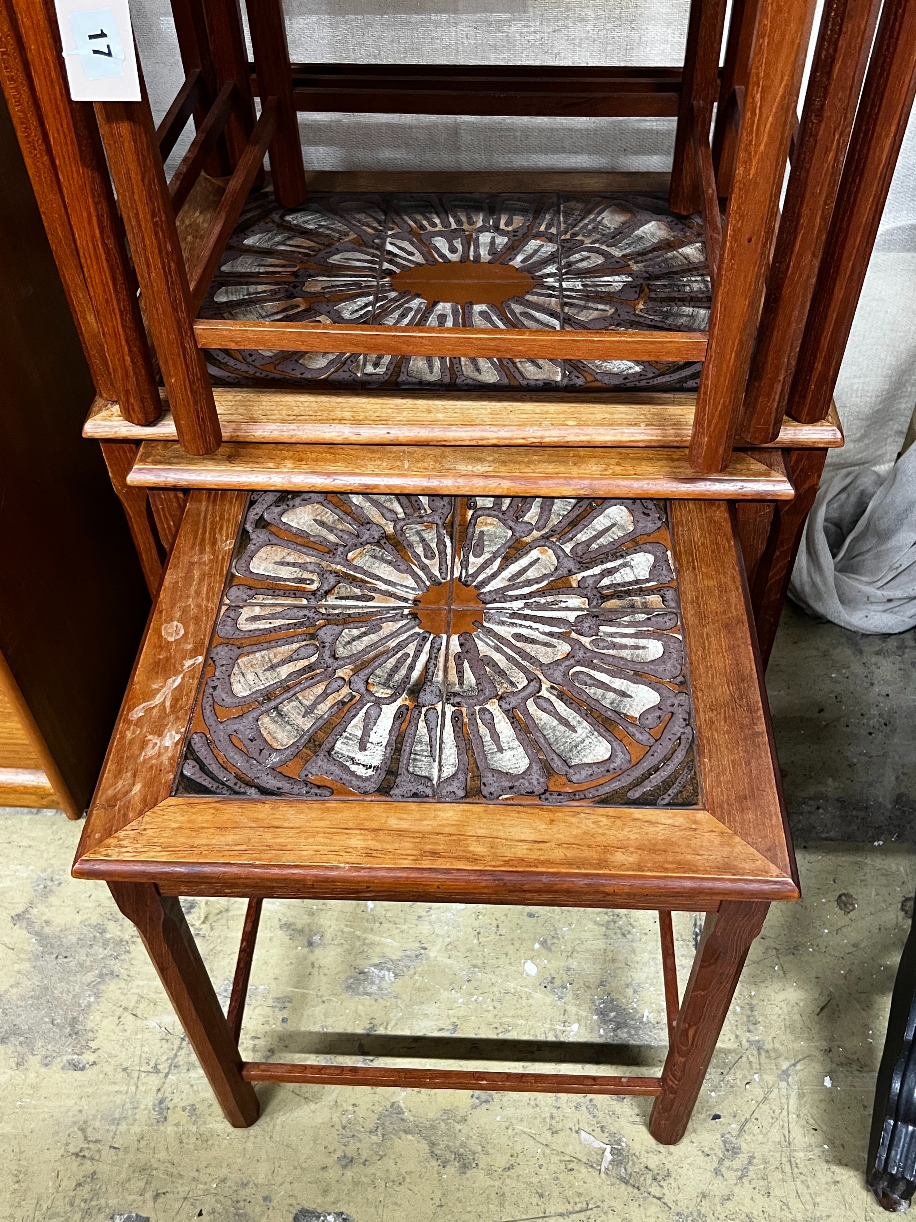 Two mid century tiled top teak nests of tables by Toften Mobelfabrikken, Denmark, width 55cm, depth 40cm, height 47cm